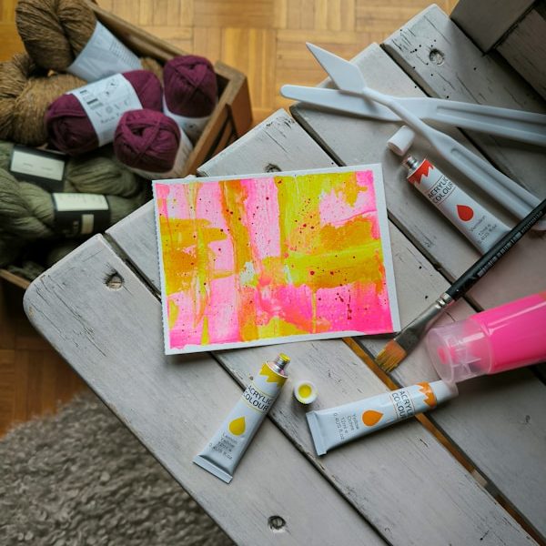 a table topped with lots of craft supplies